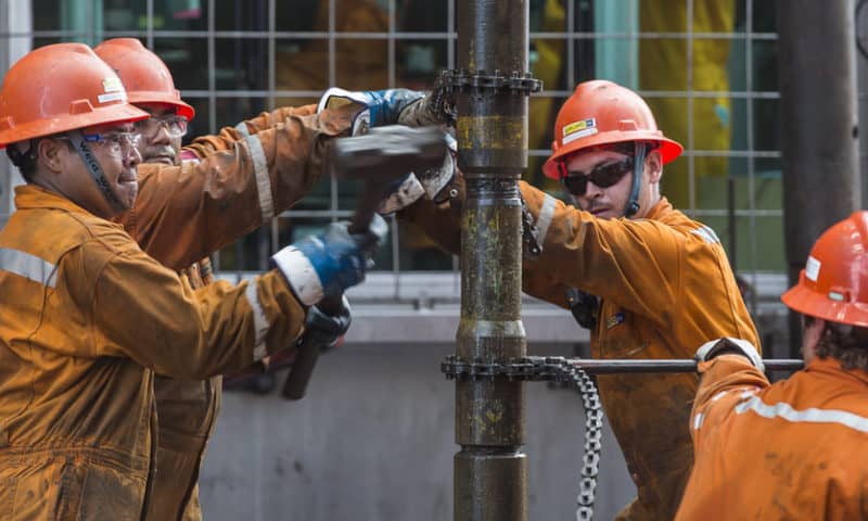 Oil prices settle at a 4-month high as U.S. crude and gasoline supplies drop