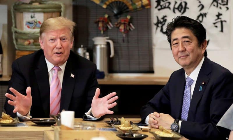 Asian markets mixed as Trump visits Japan