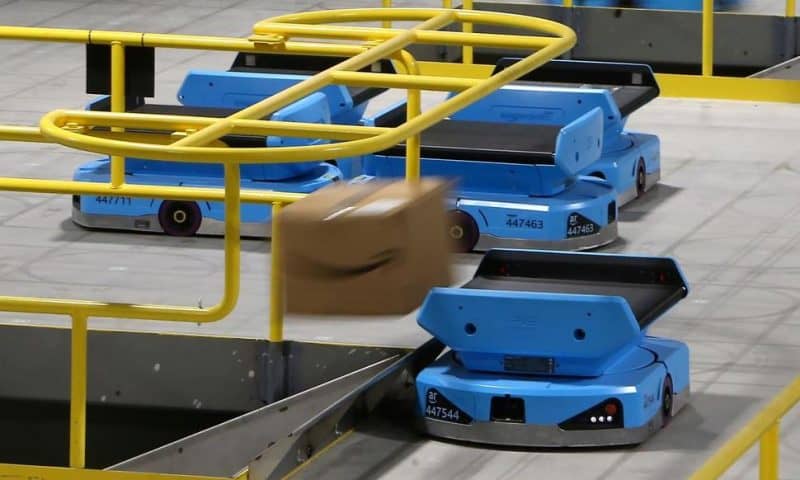 As Robots Take Over Warehousing, Workers Pushed to Adapt